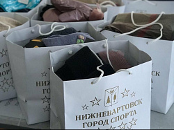 Сегодня  руководители учреждений спорта Нижневартовска  приняли участие в благотворительной акции «Согревая теплом»